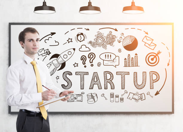 istock Man with clipboard and start up, toned 696025596