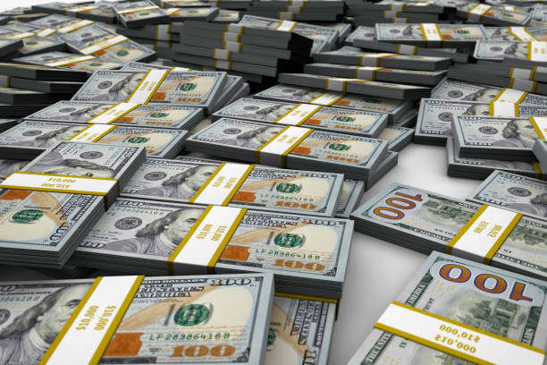 istock Bundles of New One Hundred Dollar Bill Mound 10000 696039672