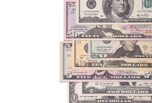 istock US american dollar money bills isolated on white background. 696039794