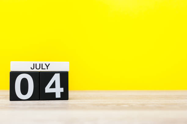 istock July 4th. Image of july 4 calendar on yellow background. Summer day. Empty space for text. Independence Day Of America 696045276