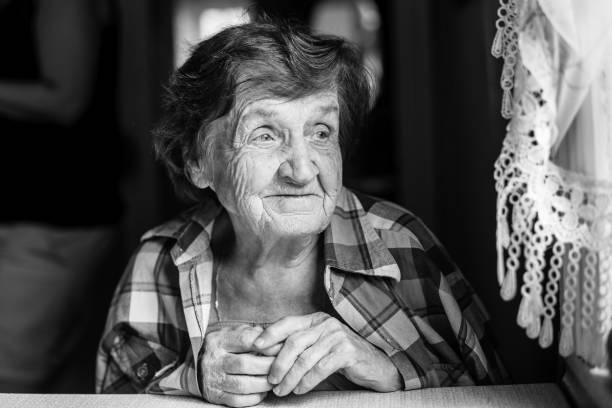 istock Peaceful elderly woman, black and white portrait. 696045534