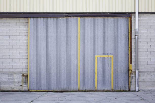 Industrial metal doors Industrial metal door street construction corrugated metal fence ideas stock pictures, royalty-free photos & images