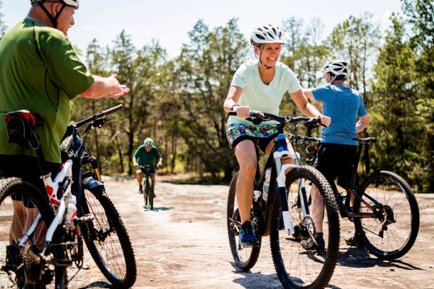 istock Woman Mountain Biking with Friends 696048420