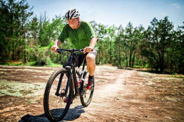 istock Senior Man Mountain Biking 696048436