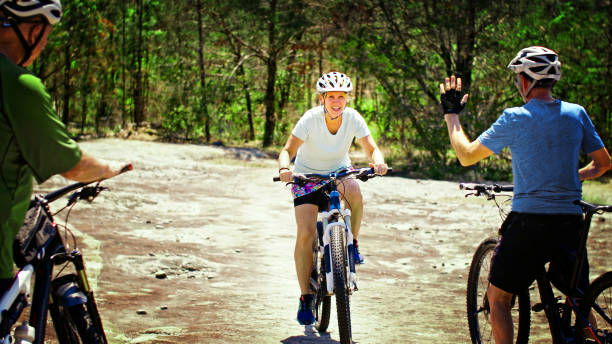 istock Woman on Mountain Bike 696048440