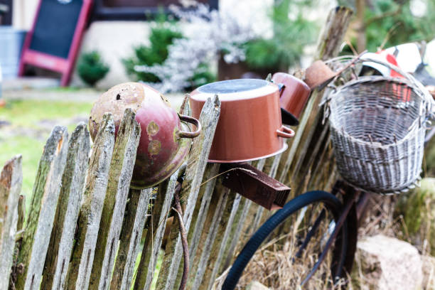 istock Old wooden fence with pots on it 696049028