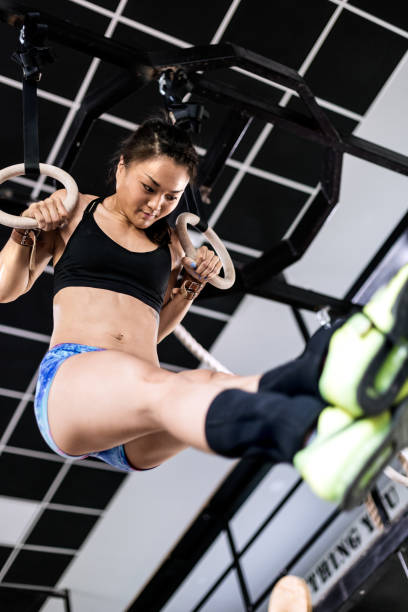 istock Asian woman on gymnastics rings 696049324