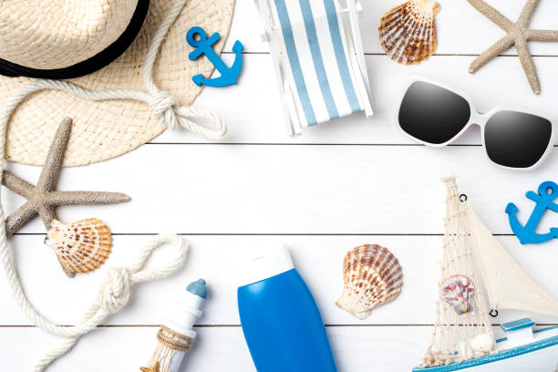 istock Beach accessories on white wooden table. 696050018