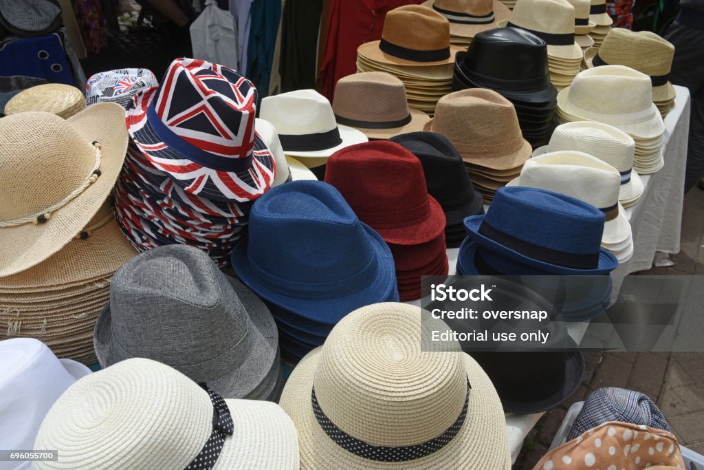 British hats English hats on sale in an English street market in Cambridge -  one displays the UK flag British Flag Stock Photo