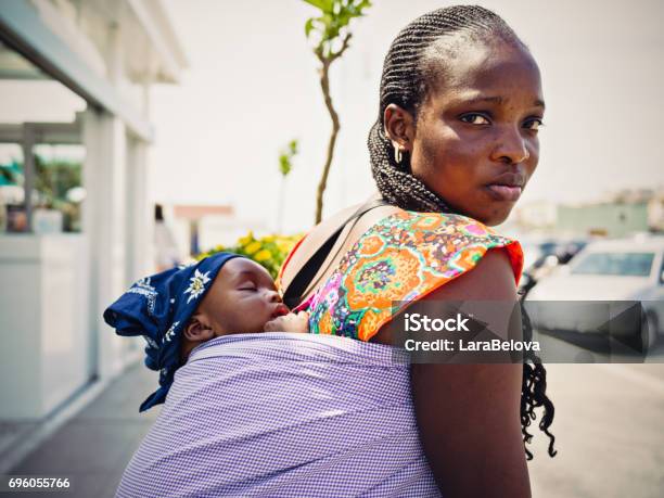 Young African Emigrant Mother With Baby Stock Photo - Download Image Now - Immigrant, Baby - Human Age, Mother