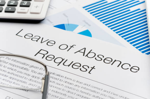 istock Leave of absence request form on a desk with paperwork. 696067716
