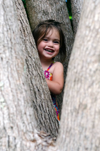 istock Girl plays hide and seek 696069986