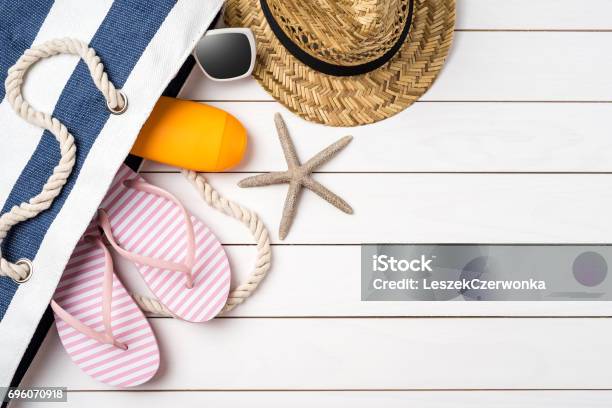 Beach Accessories On White Wooden Table Stock Photo - Download Image Now - Summer, Beach, Table