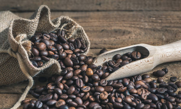 istock Coffee Beans Spilled out of Burlap Sack 696074506