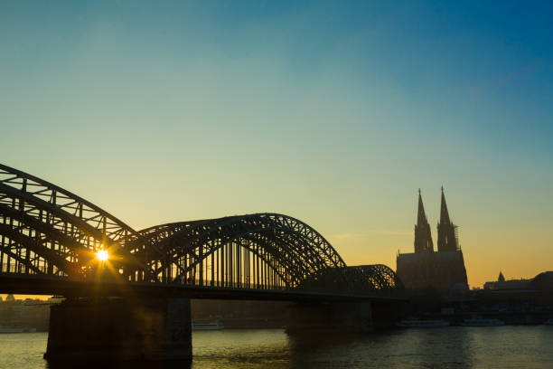 istock Sun Setting over Rhine and Hohenzollern Bridge 696077228