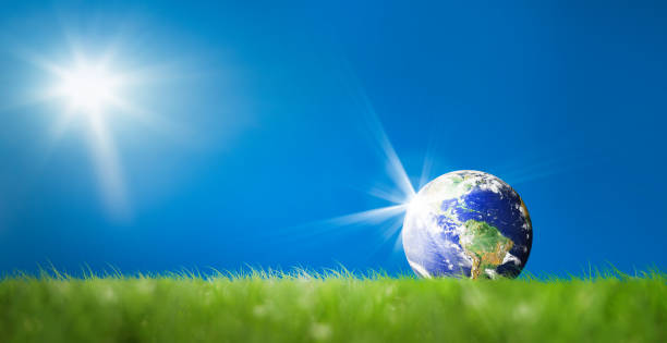istock conceptual image of world on green landscape 696077702