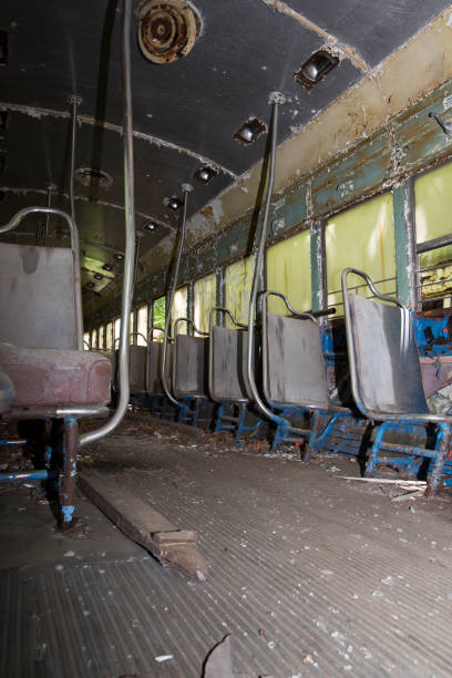 istock Seats on aisle of abandoned trolley car 696104230
