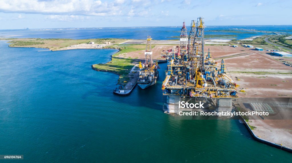Construction of Oil Rig in Texas Gulf Coast Construction of Oil Rig in Texas Gulf Coast  aerial drone view of Deep Sea Off Shore Oil Rig used for Drilling Oil in the Gulf of Mexico , the Same type of Oil rig that caused the oil spill of Deep Sea Horizon. One of the Biggest Problems of Pollution and Climate Change Today. Gulf of Mexico Stock Photo