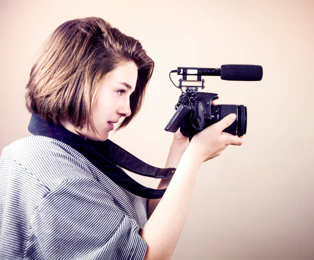 istock Young Woman Video Recording 696110992