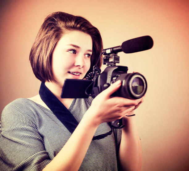istock Young Woman Video Recording 696114130