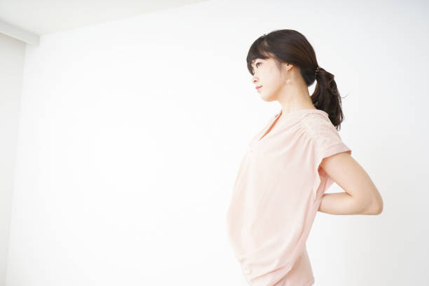istock Young woman suffering from a backache 696117756