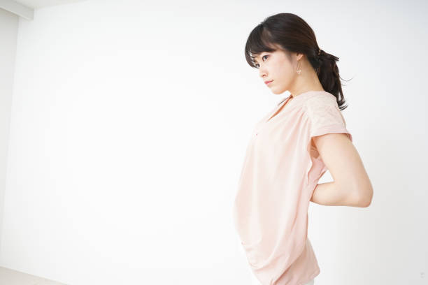 istock Young woman suffering from a backache 696117762