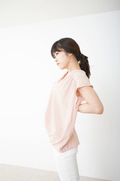 istock Young woman suffering from a backache 696117790