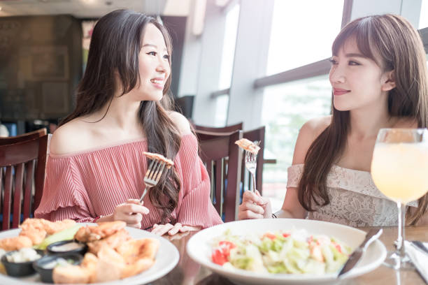 istock woman dine in restaurant 696117850
