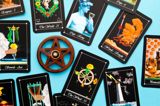 istock Tarot Deck - Tarot Readings with wooden pentagram incense burner on blue background 696120170