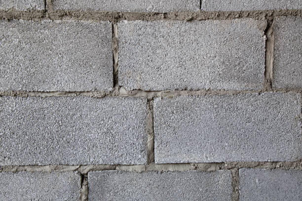 murs de brique creuse de bâtiment - hollow gray pattern wall photos et images de collection