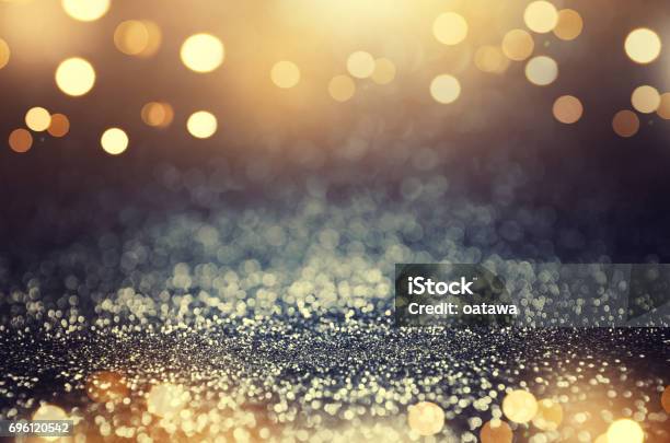 Vintage Glitter Gold Dark Blue And Black Lights Bokeh Background Stock Photo - Download Image Now