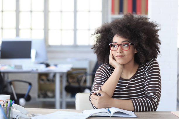 istock Young woman resting at workplace 696124286