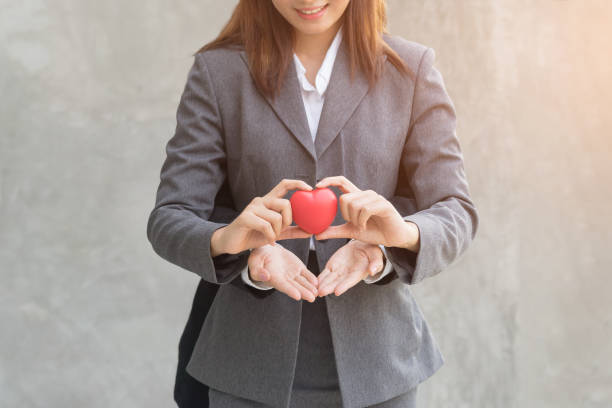 istock Woman holding red heart in hand. 696124770