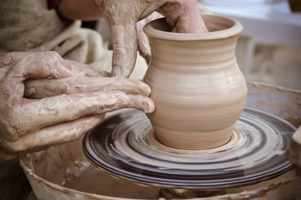 istock Master class on modeling of clay on a potter's wheel 696131386