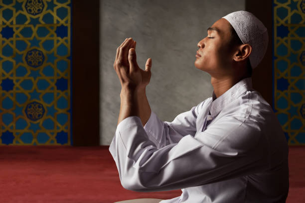 istock Asian muslim man praying in mosque 696137370