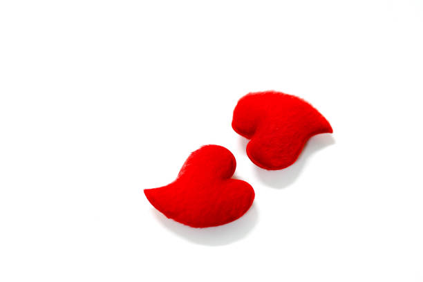 istock The two red hearts on white background 696137606