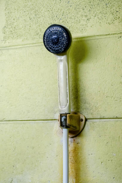 istock Old Yellow Shower on the yellow wall 696143772