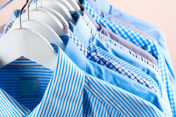 istock Cloth Hangers with Shirts. Men's clothes 696144236