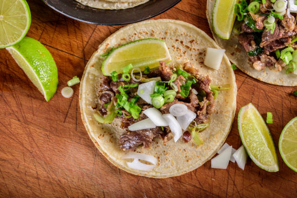istock Bulgogi over White Corn Tortilla with Scallion and Slice of Onion 696145638