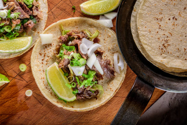 istock Bulgogi over White Corn Tortilla with Scallion and Slice of Onion 696145836