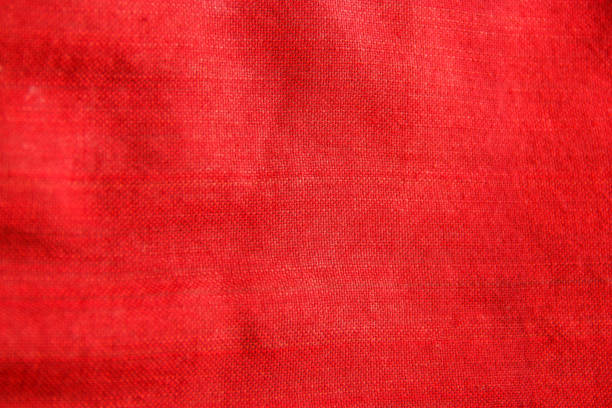 istock Close-up red traditional fabric cloth texture, textile detail background 696148520