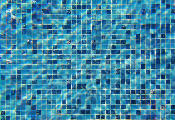 istock Water wave in swimming pool with light reflecting. Texture background. 696155540