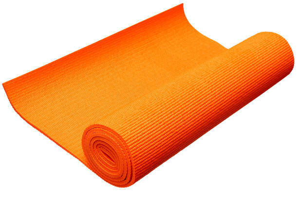 istock Orange yoga mat isolated on white background with clipping path. 696163434