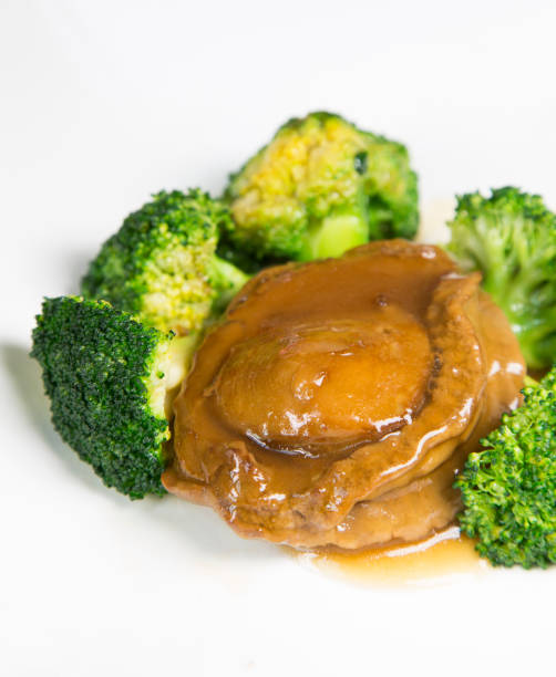 Abalone Steak Braised Whole “Abalone Steak” with Green Vegetables shenyang stock pictures, royalty-free photos & images