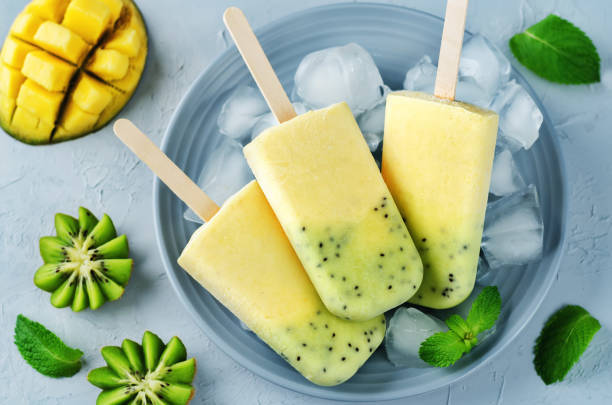 istock Kiwi mango ice cream with fruits and ices 696166406