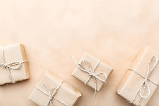 istock gifts wrapped in brown paper 696173318