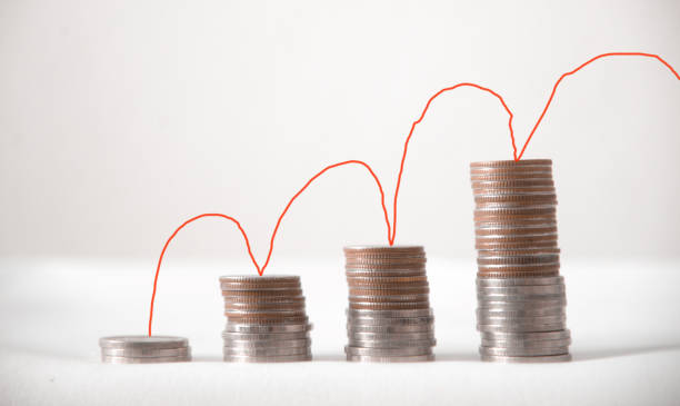 istock coin showing graph in business concept. 696174724