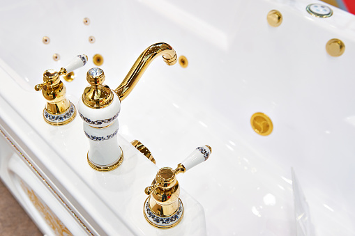 Bathtub and luxury faucet closeup