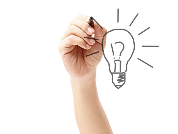 istock hand of a man drawing a light bulb 696178014