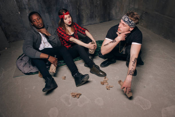 istock Group of homeless gung members gets drunk 696178668